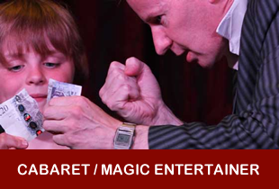 magician and boy tear a twenty pound note